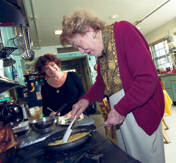 Julia Child cooks scrambled eggs for me in her Cambridge MA kitchen in 1999. Her kitchen is now in the Smithsonian.